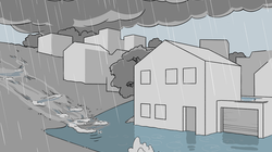 Soudain, les eaux de ruissellement de la rue et de la pente arrivent à une maison. Comme les canalisations sont surchargées, là aussi, il y a plus d'eau qui remonte à la surface que ce qui peut être évacué.