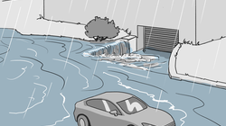 Lors d'une inondation, l'eau s'écoule souvent vers le bâtiment depuis les routes et les entrées de garage. Situation d'inondation, l'eau s'écoulant de la rue vers le bâtiment